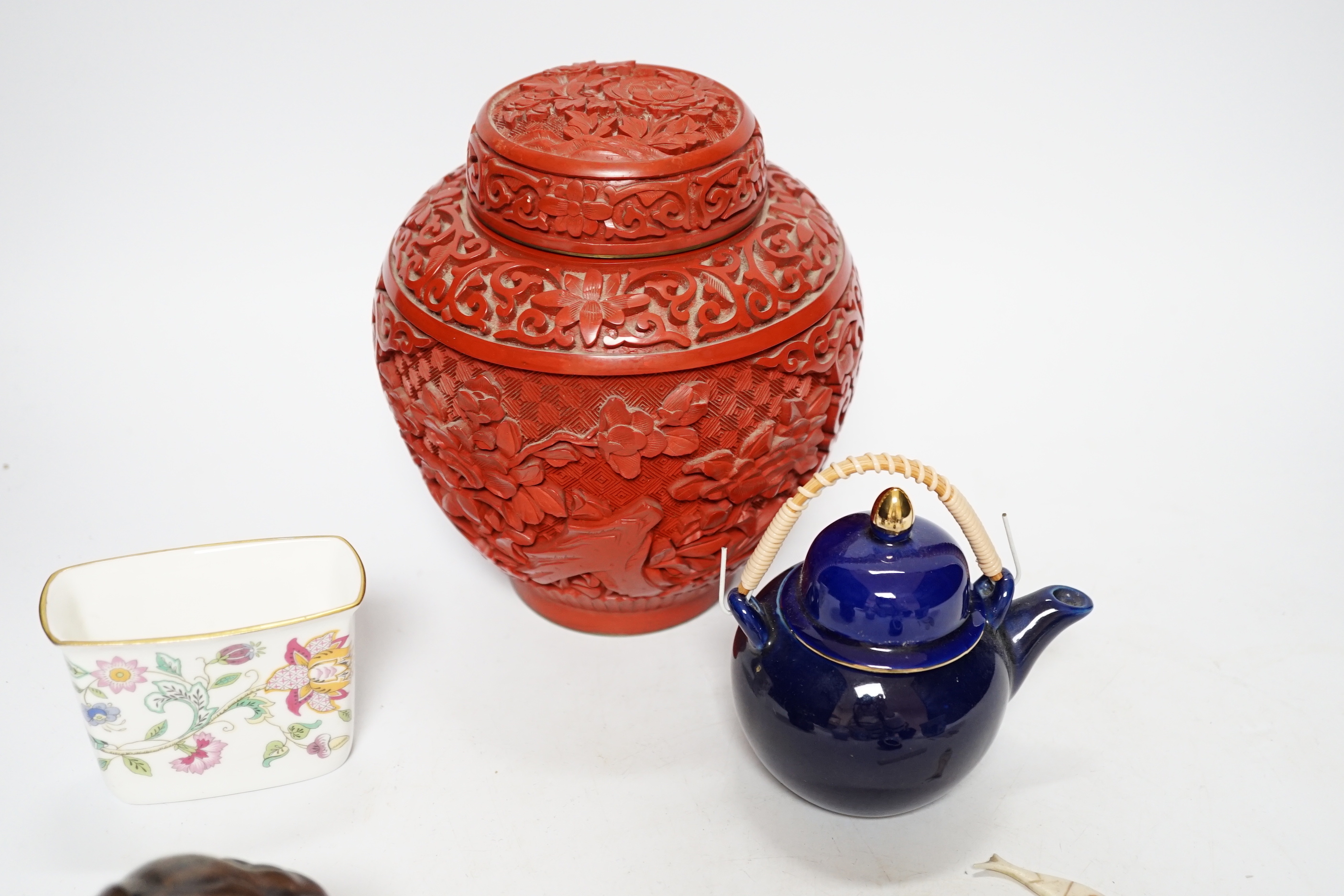A Chinese cinnabar lacquer jar and cover, a Chinese copper red bottle vase, a carved wood figure, a Meissen miniature bowl and other ceramics, jar 15cm